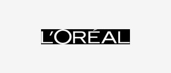 Partial close-up of the L'Oréal logo on a black background.
