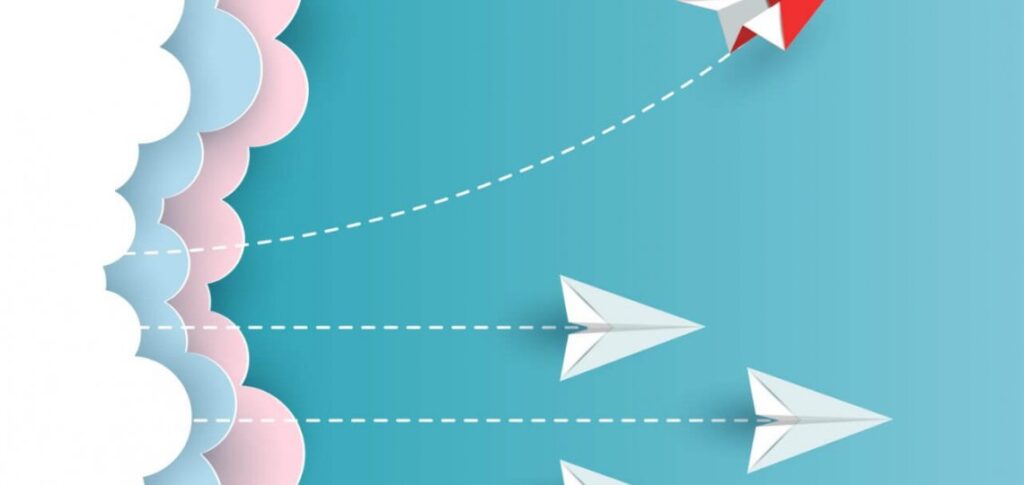 embrace-change-for-a-balanced-practice-and-life-ebccoaching Paper airplanes flying in the sky with clouds and a red kite.